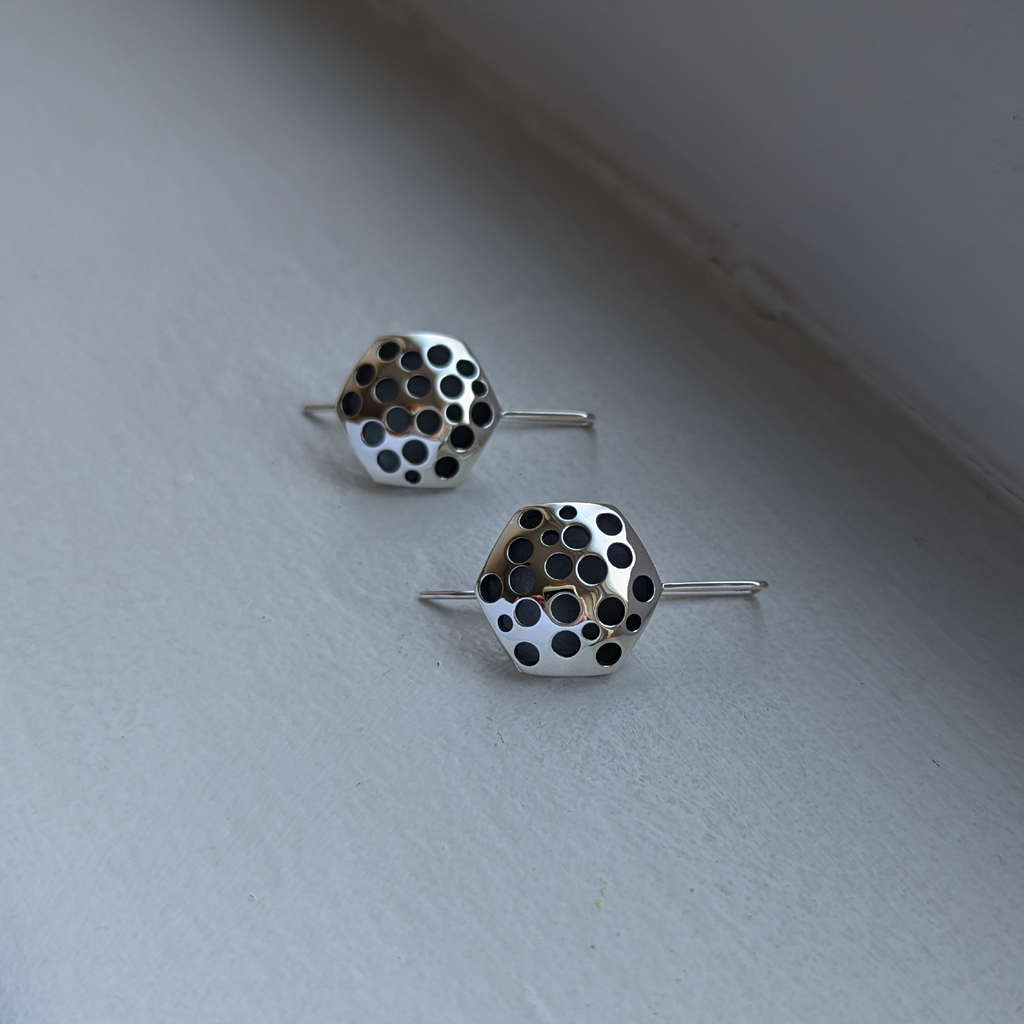 hex domed holey earrings